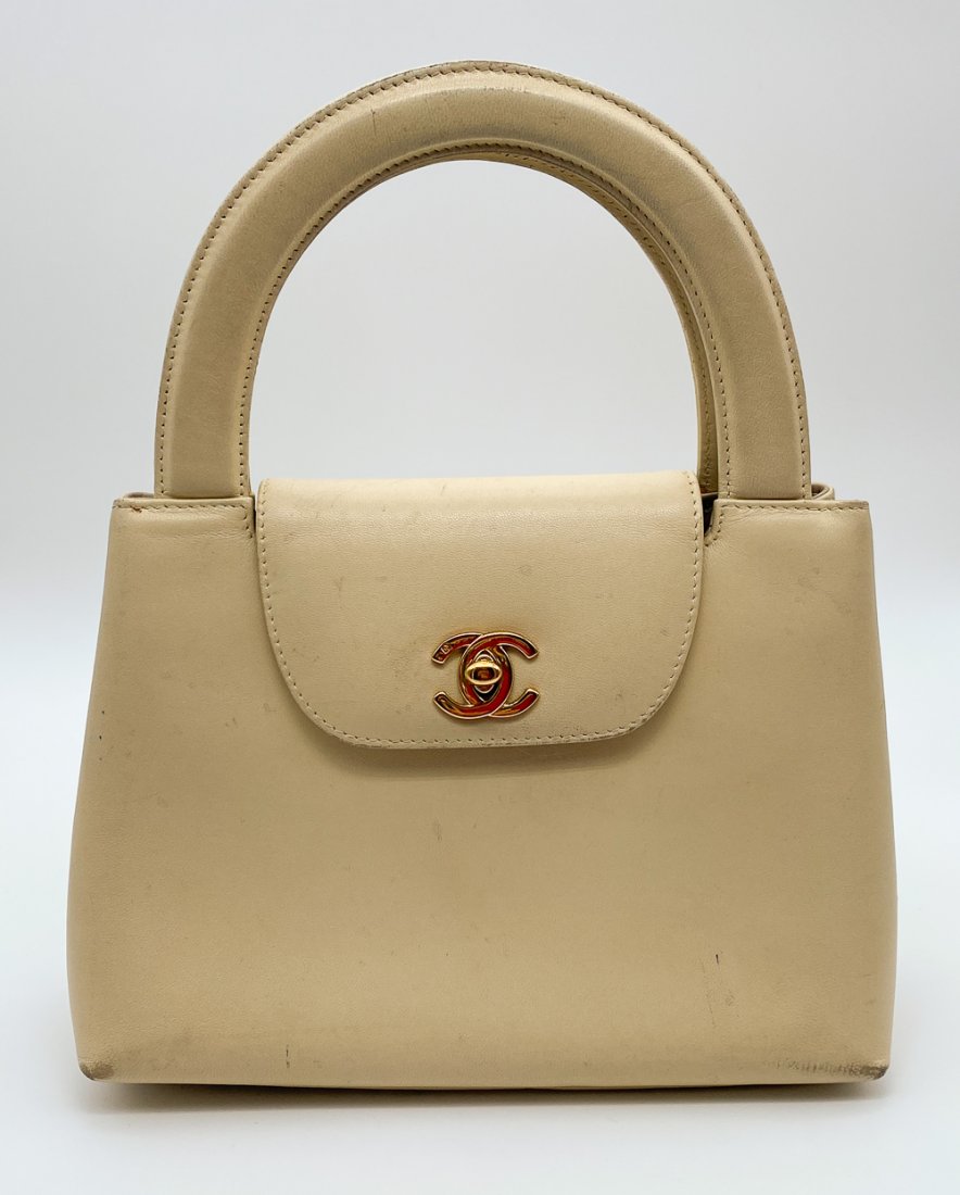 Chanel Classic Mini Bag: Likely Mini Kelly Flap Bag. 1997-1999. Made In Italy And In Vintage Condition With some Mars, Scrapes, and Scratches. Note Bottom Corners. Should Clean Up Nicely The Interior Has Slight Marks As Shown