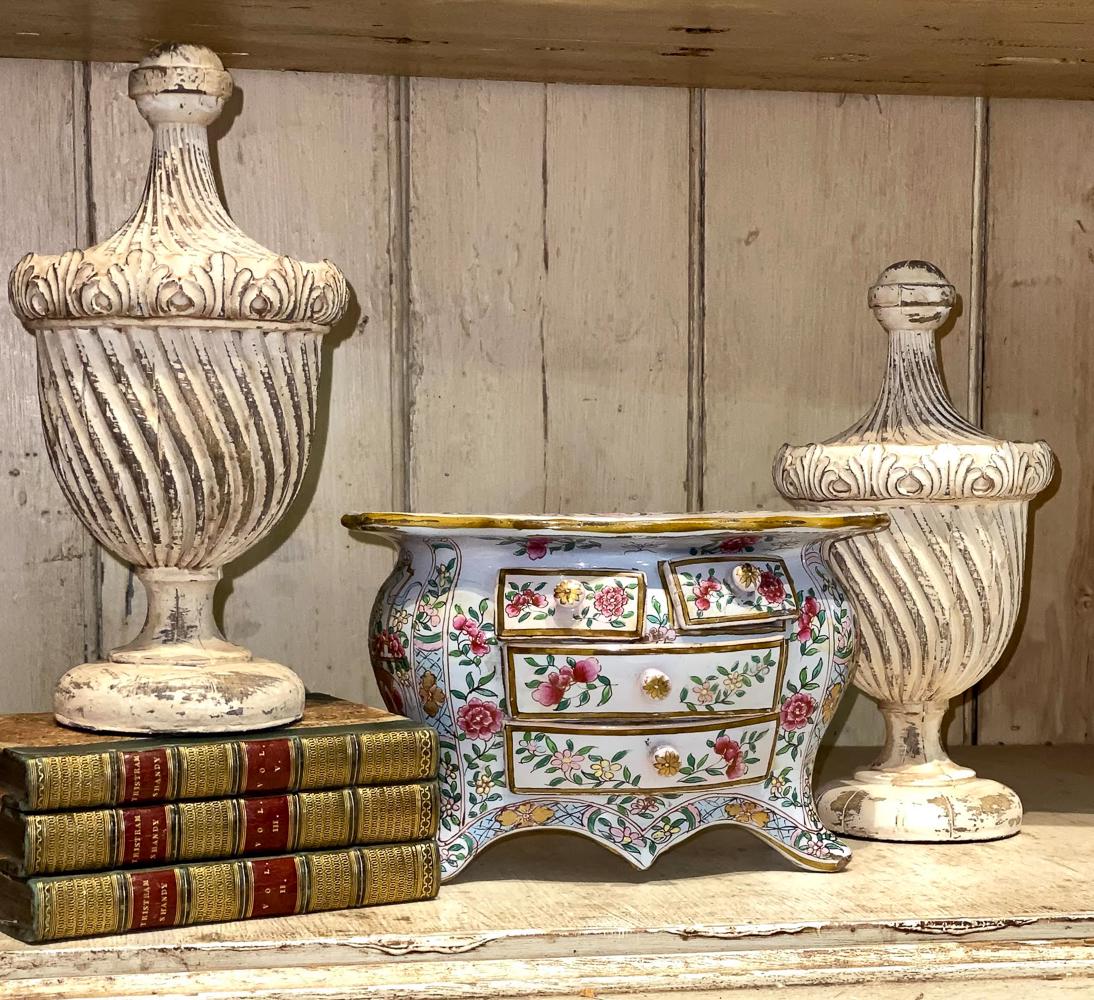 Nice Lot Of Shelf Articles: Including Miniature Antique French Porcelain Commode And Three Leather Bound Books. Pair Of Decorative Finials 10 Inches High. See Photos For Condition.
