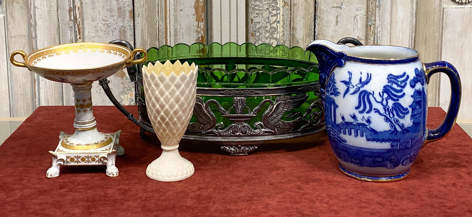 Group Of Fine Porcelains Including Dresden: Belleek Vase, Blue Willow Pitcher, Dresden Compote, And Silver Plated Centerpiece. See Photos For Good Condition. Repair To Base Of Pitcher. Centerpiece Is 17 X 5 X 8