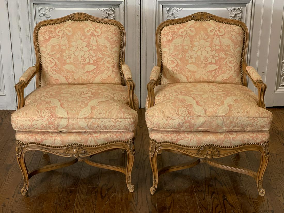 Pair Of French Style Carved Armchairs: With custom upholstery and down seat cushions. 26.5w x 37h x 27d. Seat 22.5h. 20th century.