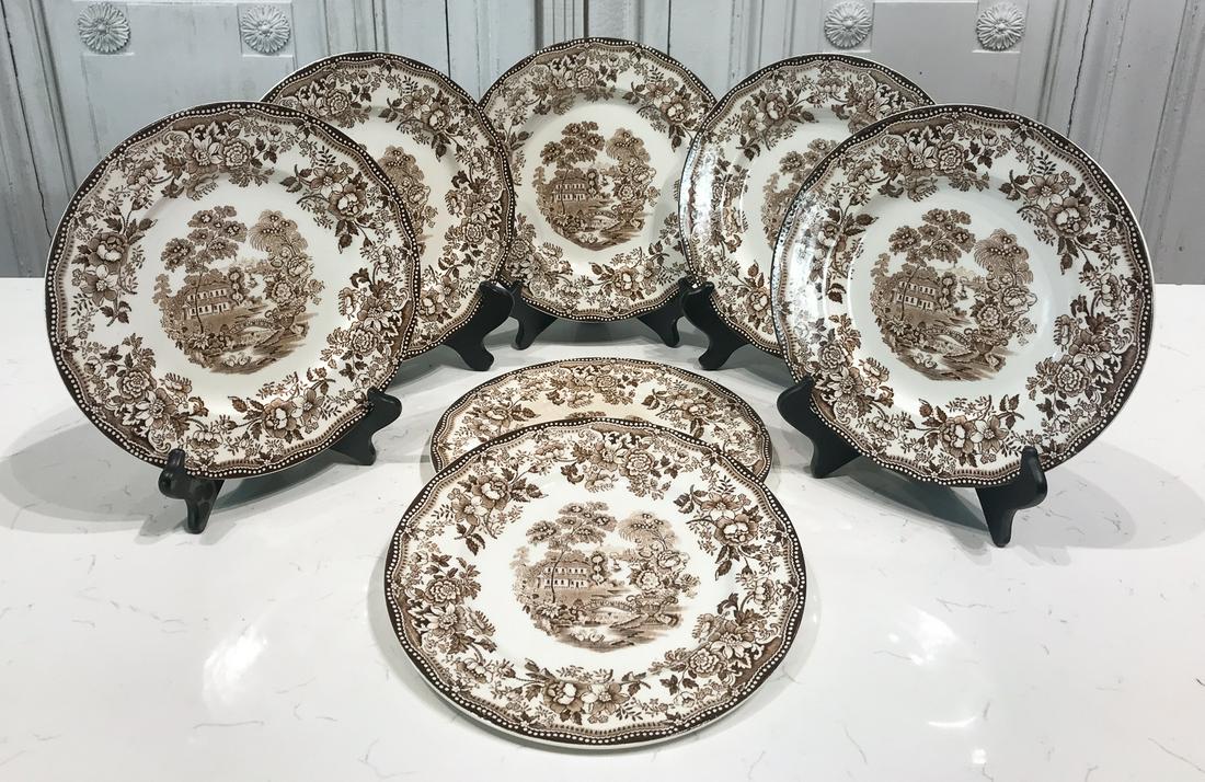 7 Royal Staffordshire Tonquin Porcelain Plates: 20th Century, Marked By Clarice Cliff Underside, Transfer Decoration In Brown, Each Diameter 10 Inches. Condition Commensurate With Age; Please Review Photos.