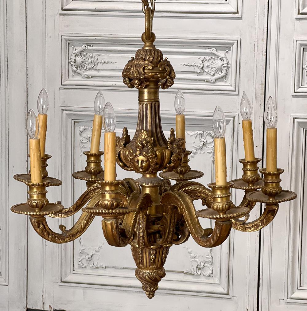 Regence Style Gilt Bronze Chandelier: 21st Century, Eight Lights, With Urn Standard With Masques, Scrolling Candle Arms With Large Bobeches And Candle Cups, Tapering Foliate Pendant Below, Electrification Present But Not Guaranteed Height