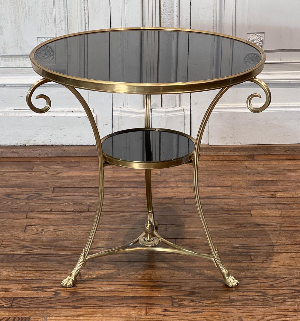 Gilt Bronze Gueridon: 21st Century, In The Hollywood Regency Taste, Black Granite Circular Top, Scroll Supports, Medial Shelf, Height 27, Diameter 32, Inches, Structurally Sound, Few Light Scratches, See Photos For Additio