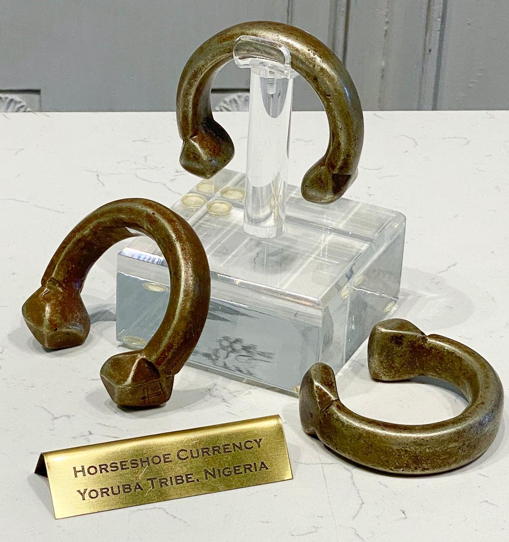 Three Pieces Yoruba Horseshoe Currency: All On Custom Lucite Stands. Likely Contains Aluminum And Silver, But Not Tested. 5.75 x 4 x 4 Each. Probably Nigeria, Yoruba Tribe. See Photos For Condition. Code H8.