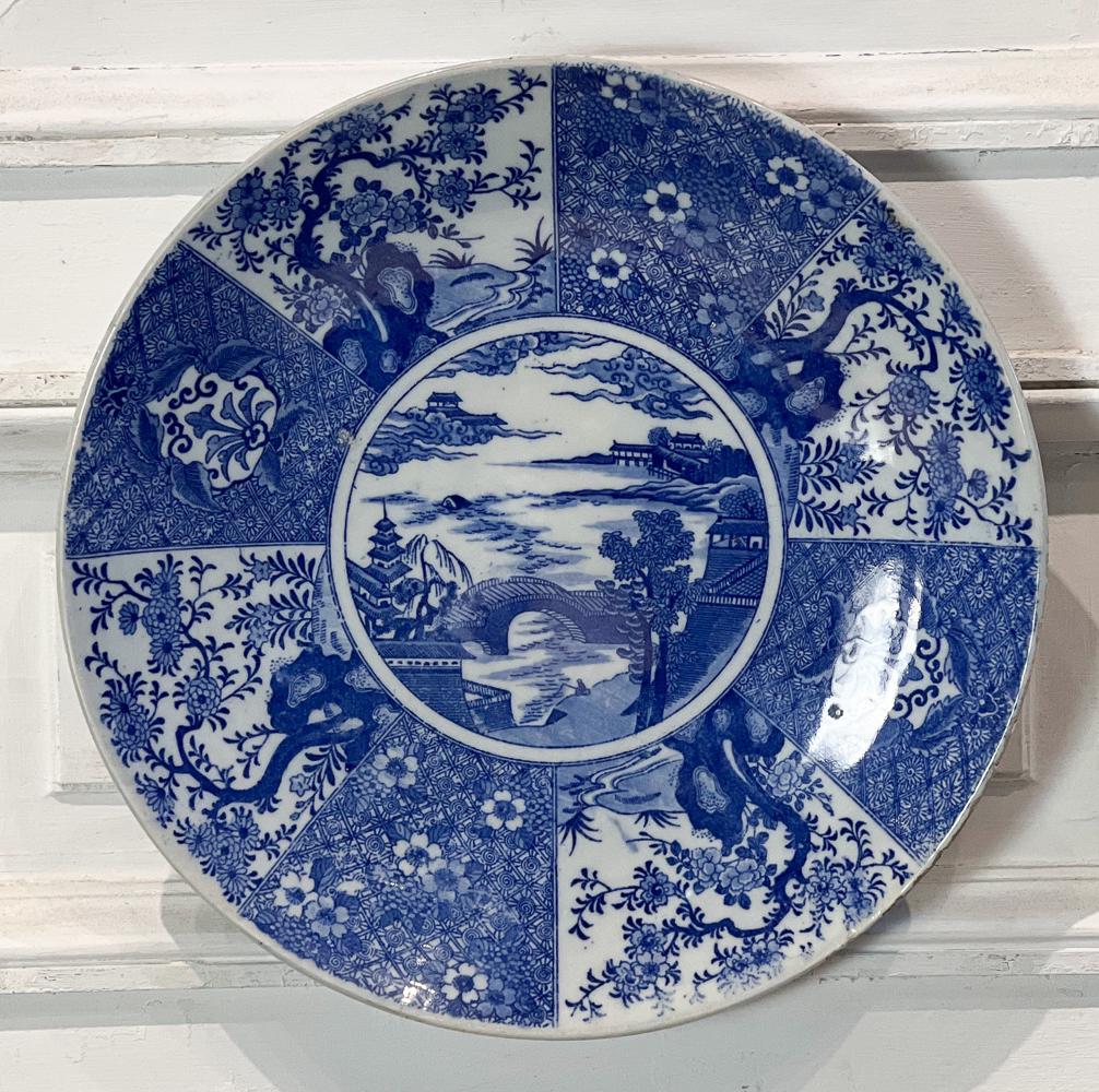 Meiji Blue And White Charger: Japanese, 19th Century, Reserve With Landscape And Bridge, Diameter 16 Inches, Abrasions And Glaze Loss To Rim, Light Crazing, Brass Hanger Affixed To Foot. See Photos For Condition.
