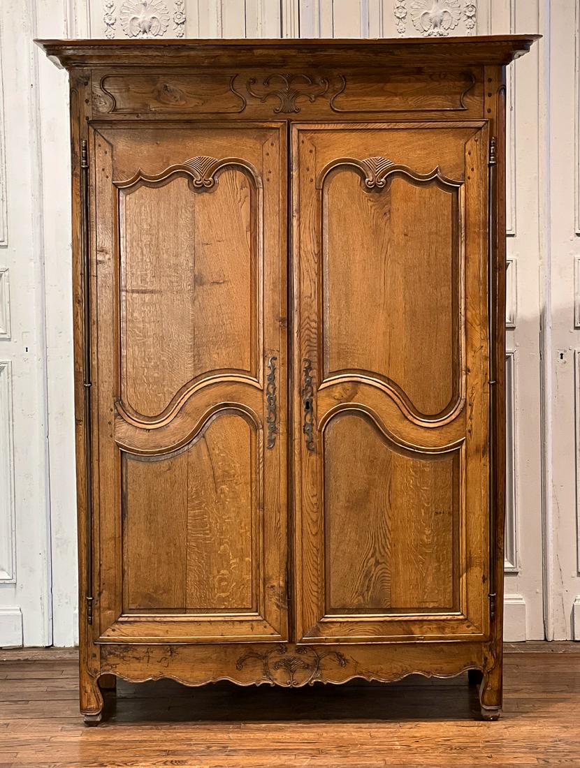 Louis XVI Style Oak Armoire: French, 19th Century. Molded Cornice, Carved Frieze And Paneled Door, Steel Fiche Hinges And Escutcheons, Shelved Interior Scallop Apron Continue To Molded Feet. Surface Scratches And Nicks Appropriat