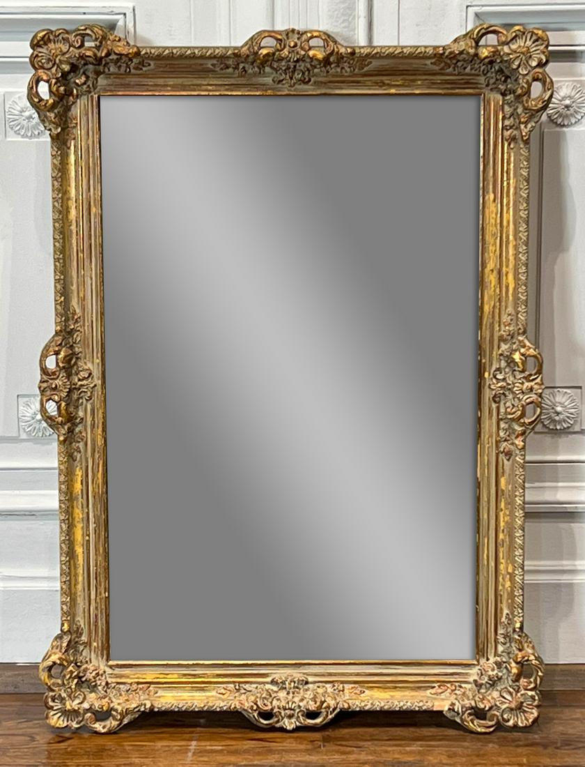 Rococo Style Giltwood Mirror: American, Mid-20th Century, Label Olson Company, Winona, Mississippi, Height 30, Width 42, Depth 2 Inches. See Photos For Additional Condition Information.