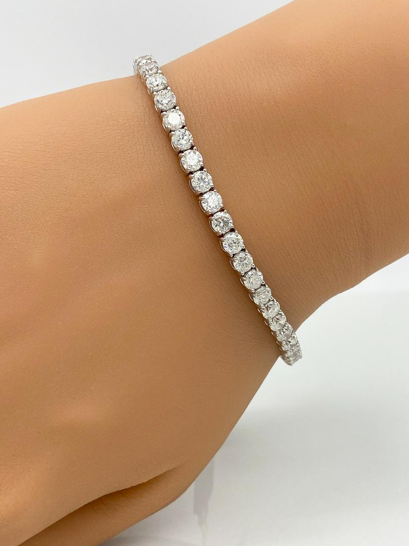 Diamond And 18k Gold Tennis Bracelet: Approximately 10.62 Carats Of Round Brilliant Cut Diamonds Comprise This Approximately 7 1/4 Inches Long Tennis Bracelet Set In 18k White Gold. Scroll Through All Photos To View Appraisal. Jewelry Pur