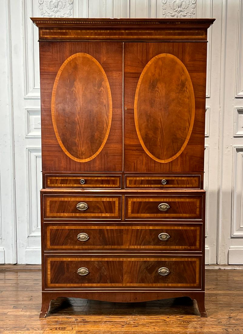 George III Style Mahogany Linen Press: English, 19th Century, Dentil Molded Cornice Upper Cabinet Doors With Oval Banded Inlay, Lower Case With Two Short And Two Long Drawers, Outswept French Feet, Height 81, Width 48, Depth 25 Inches. See