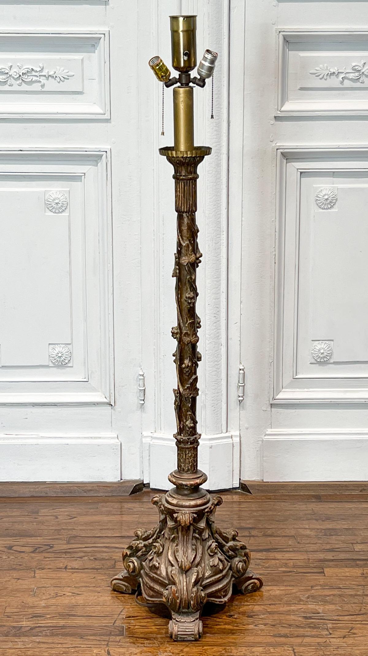 Italian Carved And Giltwood Floor Lamp: Circa 1900, In The Baroque Taste With Grapevine Standard, Foliate Tripod Base, Base Height 47, Overall Height 58.5 Diameter 15 Inches, Electrification Present But Function Not Guaranteed, Lacks Shade,
