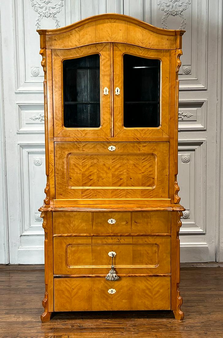 German Maple Secretary Bookcase: 19th Century. Arch Crest, Two Glazed Doors, Shelved Interior, Drop Down Desk Writing Surface, Lower Case With Three Drawers, Bone Escutcheons, 79 X 38 X 20 Inches, See Photos For Additional Condition