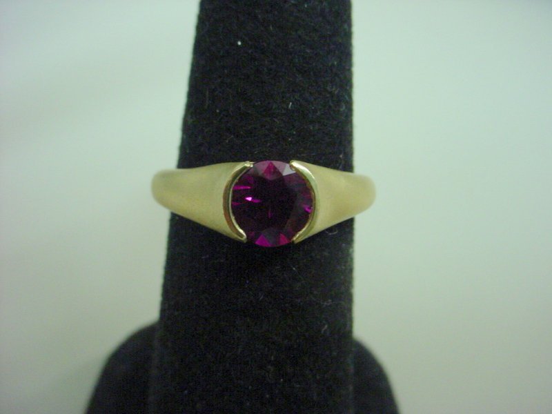 18kt. dark-pink sapphire Bvlgari pinky ring: 1.19cts center stone