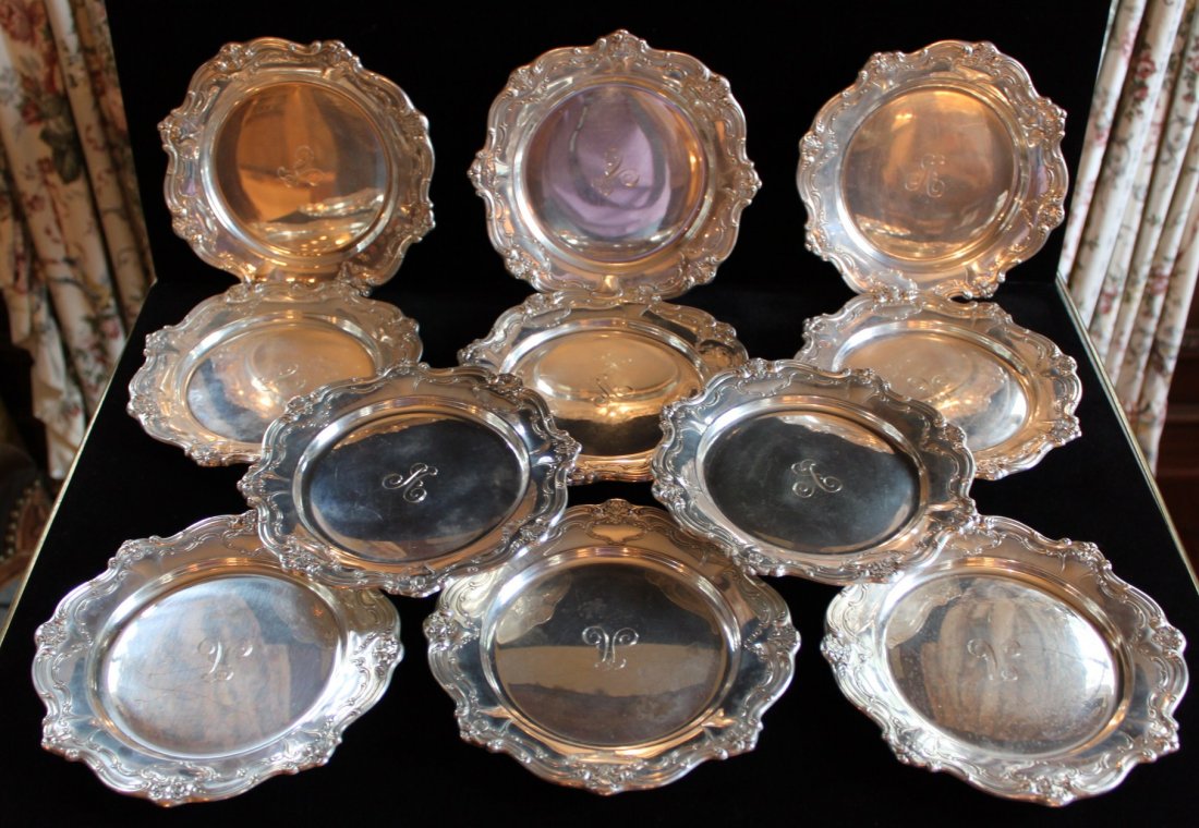Set of 12 sterling silver butter pats: with initial A engraved in each Measurements: 6 1/4" dia
