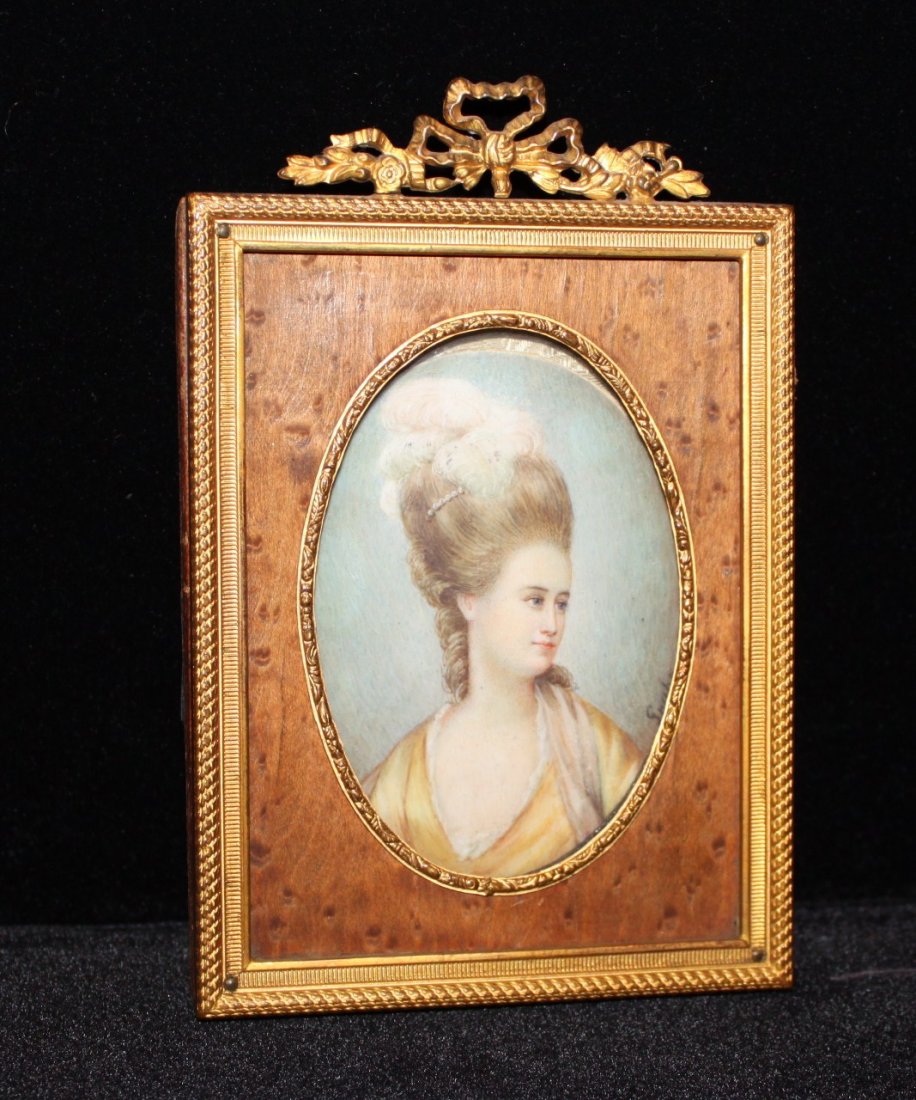 Antique French Portrait of Lady: bronze filigree frame holding, hand painted on ivory, with bird's eye maple liner Measurements: 5 1/2 x 3 1/2