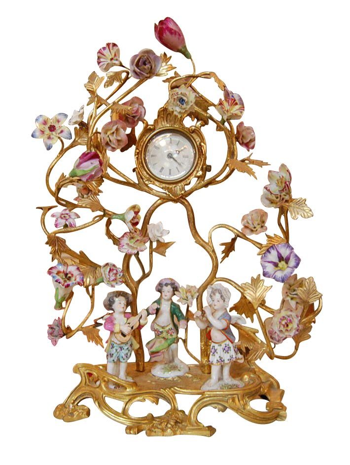 French gilt bronze clock: with Miessen figurines and floral adornments, 19th c.