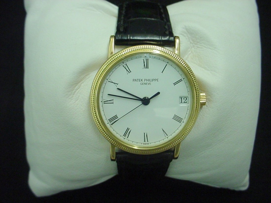 18K Vintage Patek Philippe Watch: yellow gold with 18kt. gold Patek buckle. It is called a Calatrava with an automatic movement and sweep second hand.