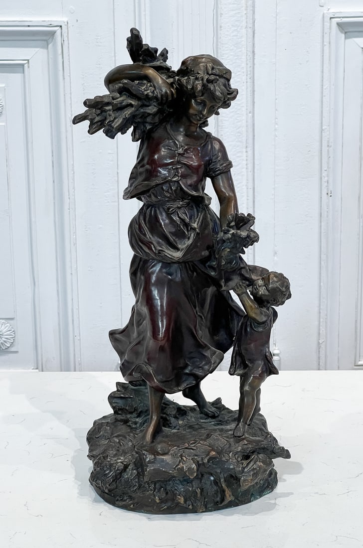 Woman And Child Bronze After Moreau: 20th Century, After Hippolytus Moreau, Young Woman Striding With Firewood Handing Flowers To A Child, Height 19, Width 9, Depth 9 Inches. See Photos For Additional Condition Information.