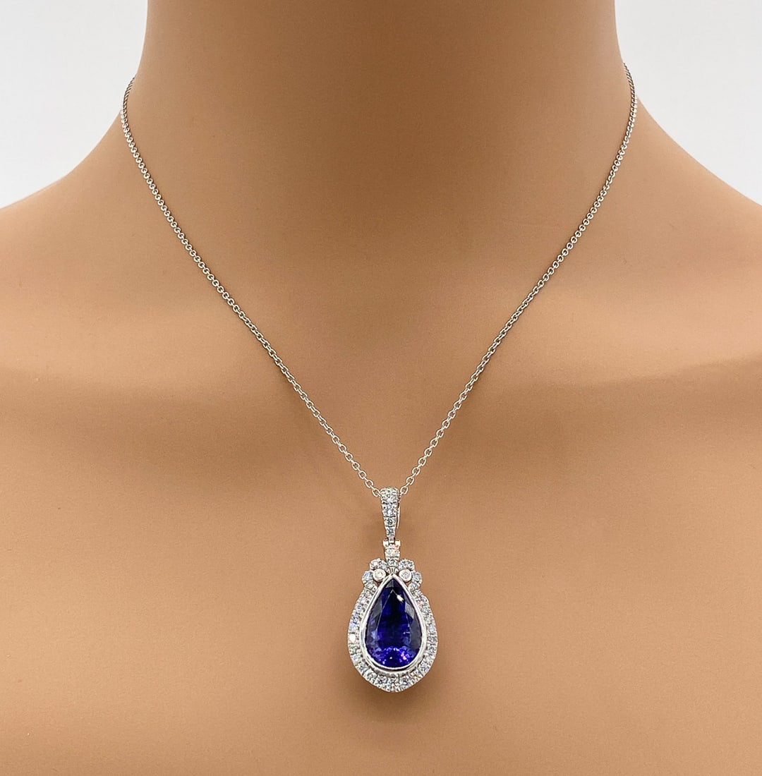 GIA Tanzanite And Diamond Pendant: GIA Certified 9.17ct Pear Shaped Tanzanite With 0.81ct Diamonds Set In Platinum. Pendant Is 1 1/2 Including Bail. Platinum Chain Measures 8 3/4. 13.3g. Scroll Through All Photos To View Appraisal. Jew