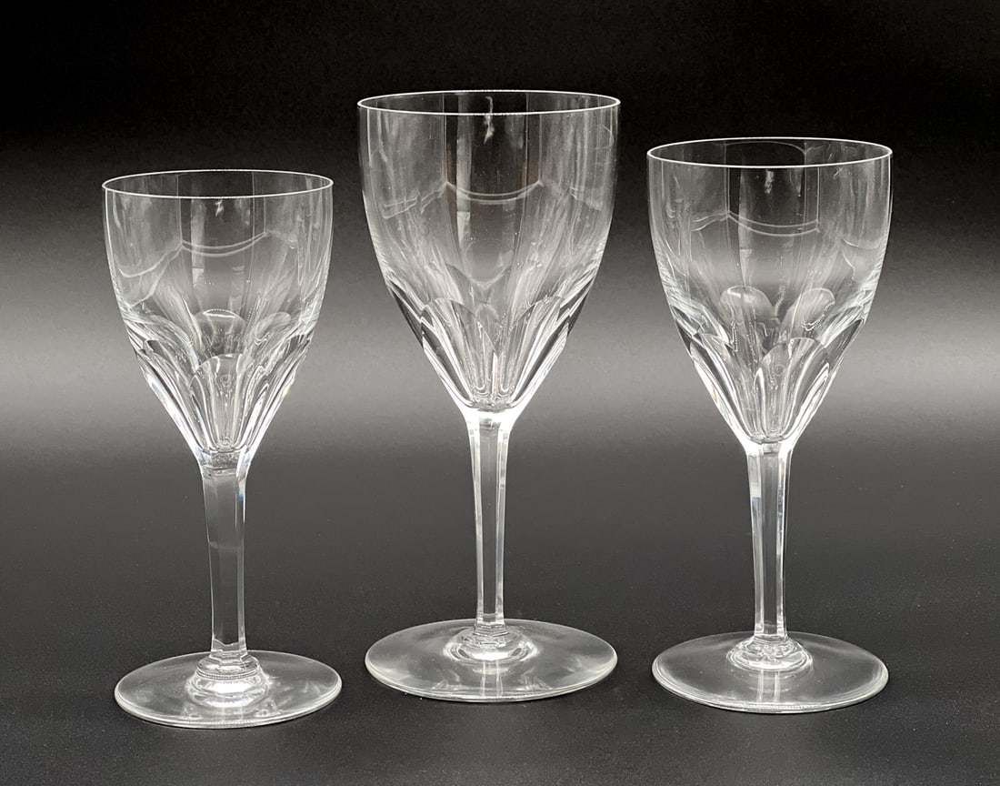 Twenty-Seven Baccarat Genova Crystal Stems: French, 20th Century, All Marked Underside, Twelve Glass Water Goblets, Twelve Red Wine And Three White Wine Stems, Heights 7.5, 7, And 6.5 Inches, Respectively. See Photos For Additional Condition In