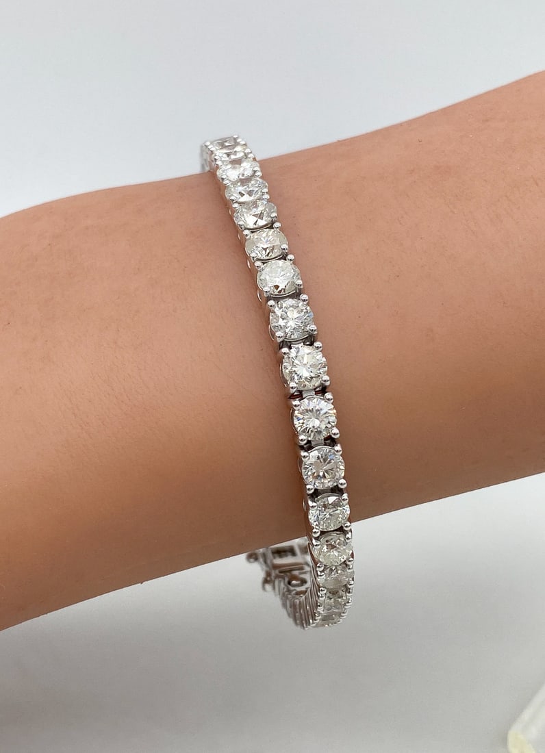 Diamond Tennis Bracelet, 14k White Gold: 11.43ct SI1-I2, G-H Diamonds Set In 14k White Gold Comprise This Diamond Tennis Bracelet. Approximately 7 Inches. Scroll Through All Photos To View Appraisal Information. Jewelry Must Be Paid By Wire 