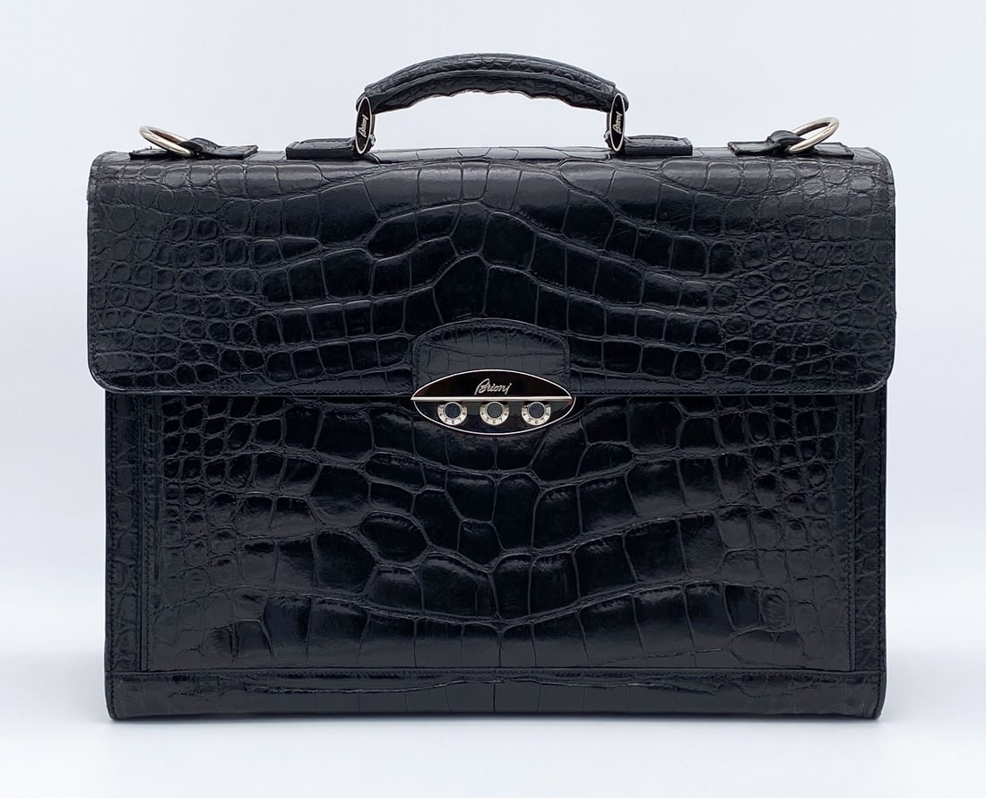 Brioni Black Alligator Briefcase Bag: Silver Toned Hardware And Triple Gusseted Interior. Approximately14.5 Inches High (Including Handle) X 16.25 Wide X 5.5 Deep. Some Wear To Corners And Flap Edges As Shown In Photos. Scratching At Feet