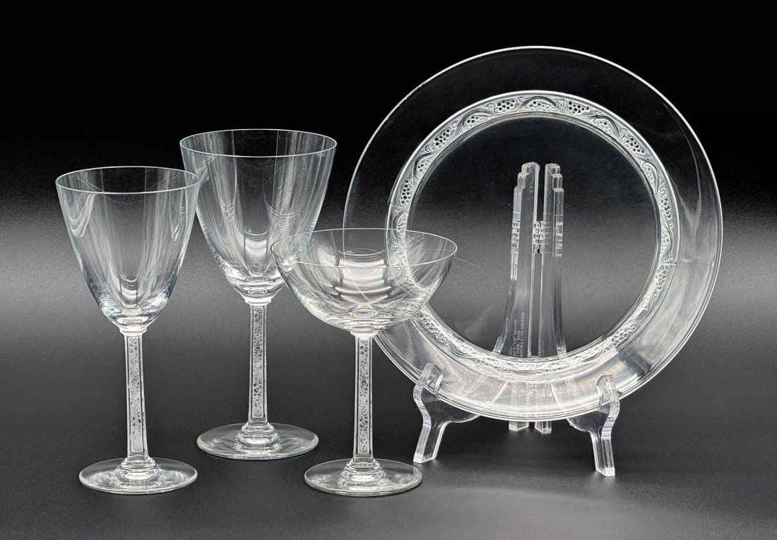 48 Pieces Lalique Phalsbourg Crystal: French, After 1945, Comprising 8 Champagne Coupes, 5.25 Inches; 15 Wine Glasses, 6.75 Inches; 13 Water Goblets, 7.25 Inches; 12 Plates, 8.75 Inches Diameter. Marked Cristal Lalique France Underside. S