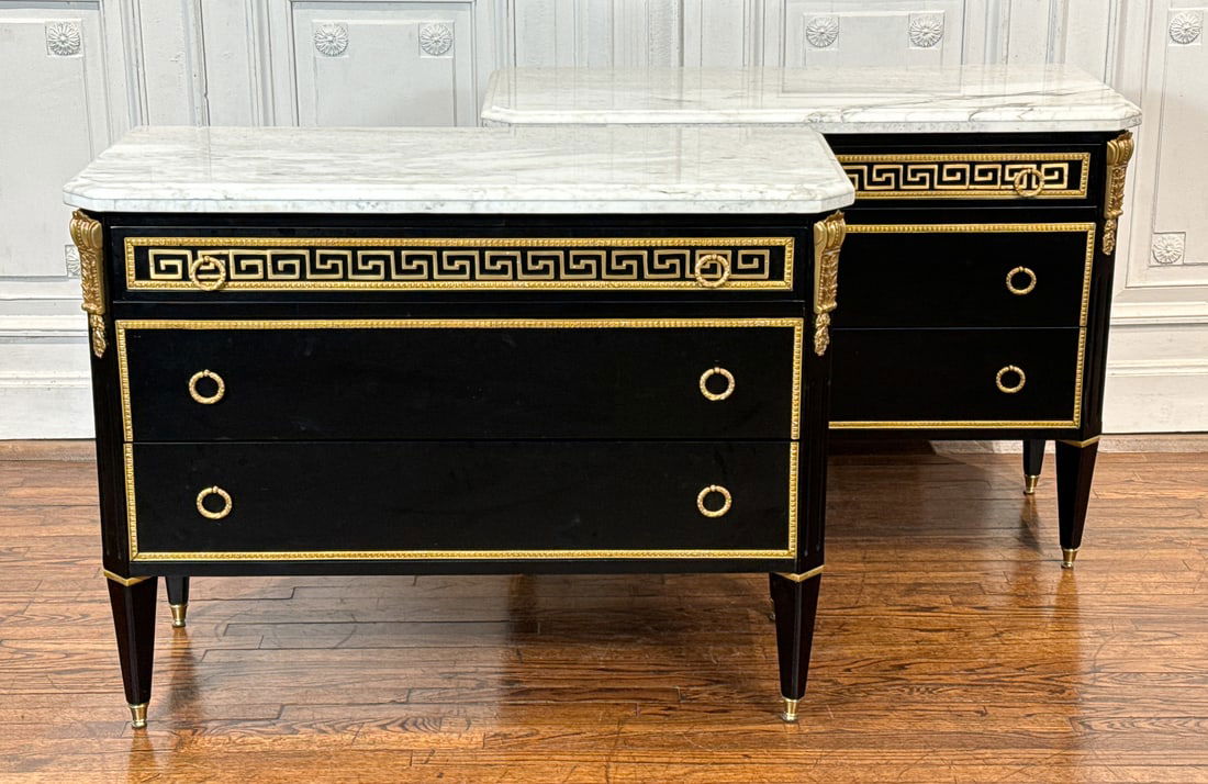 Pair Empire Style Gilt Bronze Mounted Commodes: Pair Empire Style Gilt Bronze Mounted Commodes, 20th Century, Each Ebonized Case With White Carrara Marble Top, Drawered Frieze With Greek Key Mount, Canted And Fluted Stiles, Two Drawers And Tapering