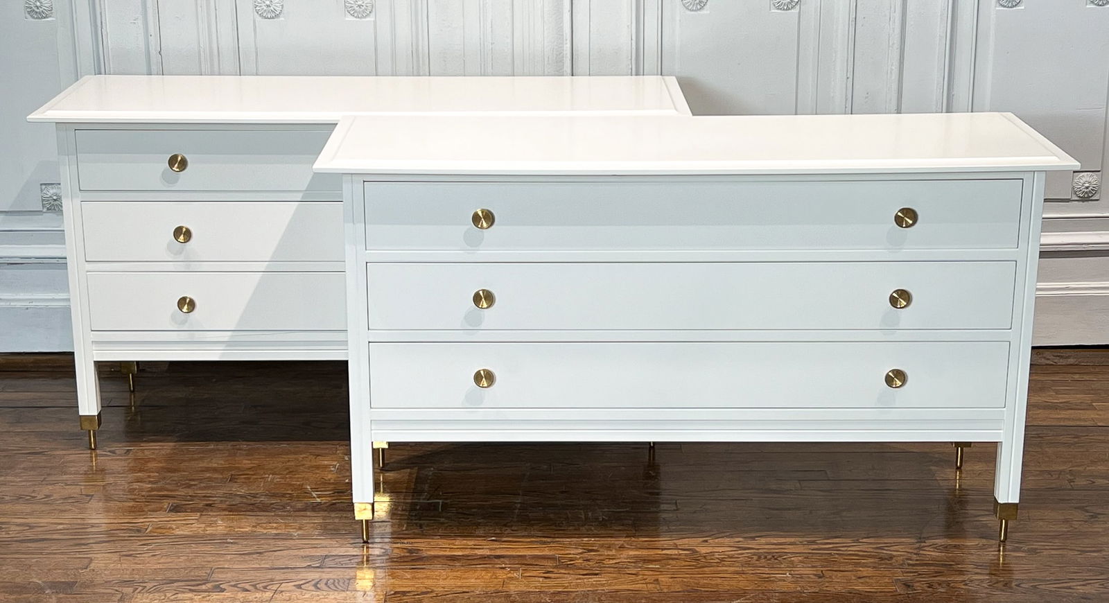 Pair White Lacquer Commodes: Pair White Lacquer Commodes, 21st Century, Each With Molded Top, Three Drawers, Brass Cuff And Rod Feet, 31 Inches High, 57 Inches Wide, 21.5 Inches Deep, See Photos For Additional Condition Informati