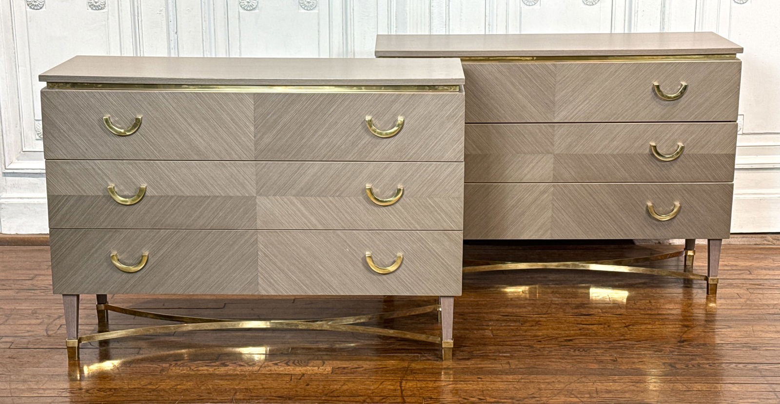 Pair Italian Grey Lacquer Commodes: Pair Italian Grey Lacquer Commodes, 21st Century, Each With Inset Brass Frieze Molding, U-form Pulls On Three Drawers, Bookmatched Side Panels, And Brass Stretchers On Square Tapering Legs, Height 34,
