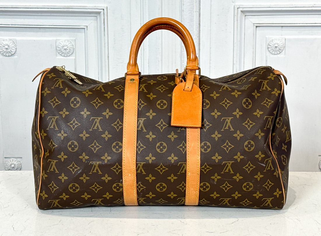 Louis Vuitton Keepall Bandouliere 45: Louis Vuitton Keepall Bandouliere 45, Interior Stamp Indicates France 1989. Slight Soiling To Vachetta Trim, Some Scratches As Evident In Photos. Retains Luggage Tag. Consistent Patina To Hardware. Ap