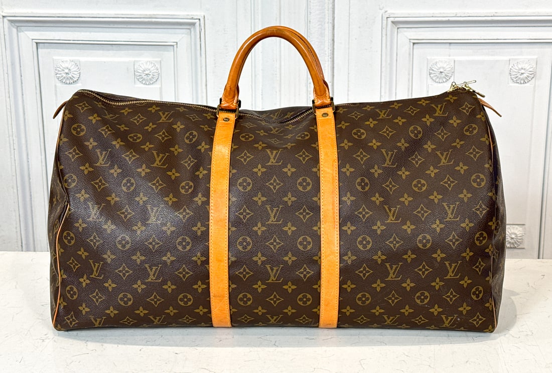 Louis Vuitton Keepall Bandouliere 60 Bag: Louis Vuitton Keepall Bandouliere 60 Bag. Date Code Stamp Sd1913 Indicates France Or Usa, 1993. Some Staining And Signs Of Use To Underside Trim. Scuffing To Underside Edges And Piping. Two Corners Sh