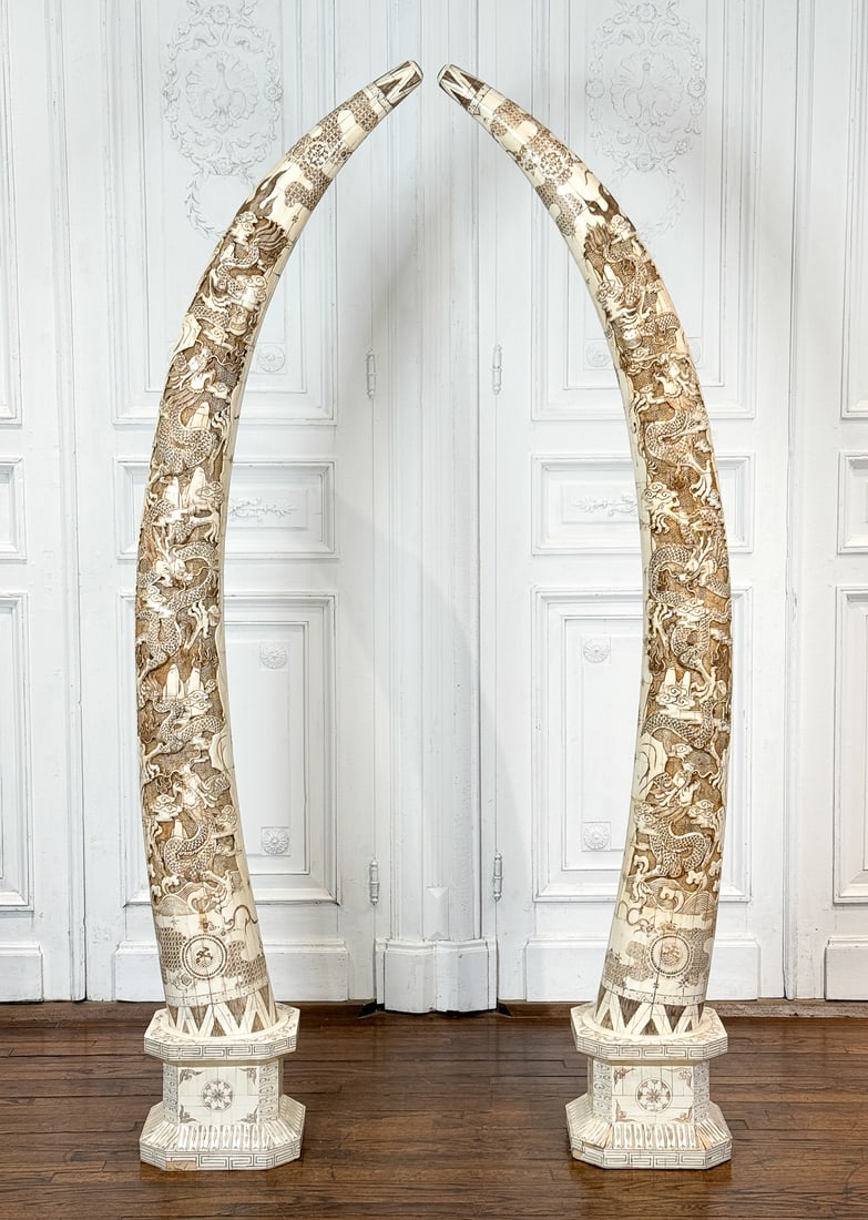 Pair Palace Size Bone Veneer Tusks, Over 7' High: Pair Palace Size Bone Veneer Tusks, Over 7 Feet High, Probably Chinese, Early 21st Century, Carved With Clouds And Dragons On Integrated Bases, Each Height 88, Width 24, Depth 12 Inches, Structurally 