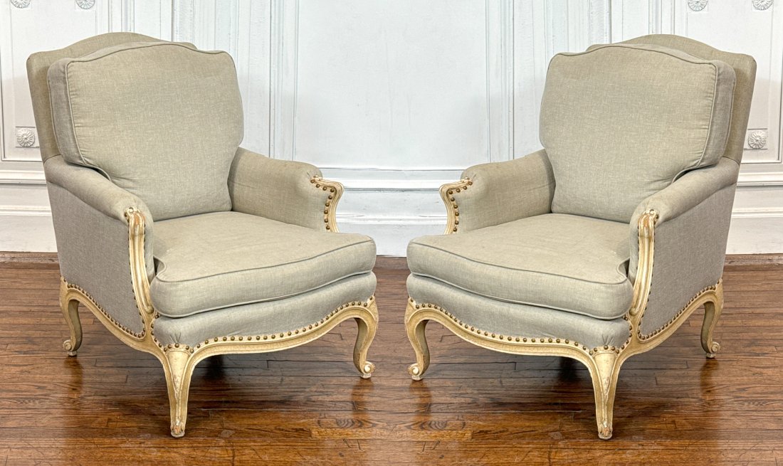 Pair Louis XV Style Bergere Armchairs: Pair Louis XV Style Bergere Armchairs, 20th Century, Cream Paint With Scroll Arm Supports, Taupe Muslin Upholstery, Nailhead Trim, Height 36, Width 28, Depth 29 Inches, Slight Soiling To Arm Ends And 