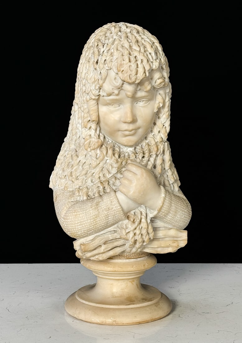 Carrara Marble Bust Of Girl With Fishnet Shawl: Carrara Marble Bust Of Girl With Fishnet Shawl, Italian, 19th Century, In A Sweater With Shawl Wrapped On Her Head, 18.5 X 9.5 X 5 Inches, Various Discolored Areas, 5 Inch Triangular Loss To Lower Bac