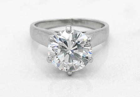 GIA 3.10ct Diamond And Platinum Ring: 3.10 Carat Round Brilliant Cut F, SI1 Diamond Set In Platinum. Central Diamond Measures 9.46 - 9.53mm In Diameter; Approximate Depth 5.55 Mm. Size 7 1/2. Ex-Heritage Auctions, Lot #55022, September 29