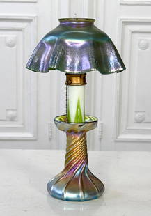 Tiffany Studios Favrile Glass Candlestick Lamp: Tiffany Studios Favrile Glass Candlestick Lamp, American, Early 20th Century, Base Marked L.C.T. Favrile Underside, Shade Marked L.C.T. On Rim, Height 12, Diameter 7 Inches, Multiple Flea Bites On Ass