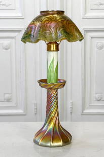 Tiffany Studios Favrile Glass Candlestick Lamp: Tiffany Studios Favrile Glass Candlestick Lamp, American, Early 20th Century, Marked L.C.T. On Shade Rim And Stick Underside, Height 14.5, Diameter 7 Inches, Flea Bite On Associated Tiffany Shade Rim,
