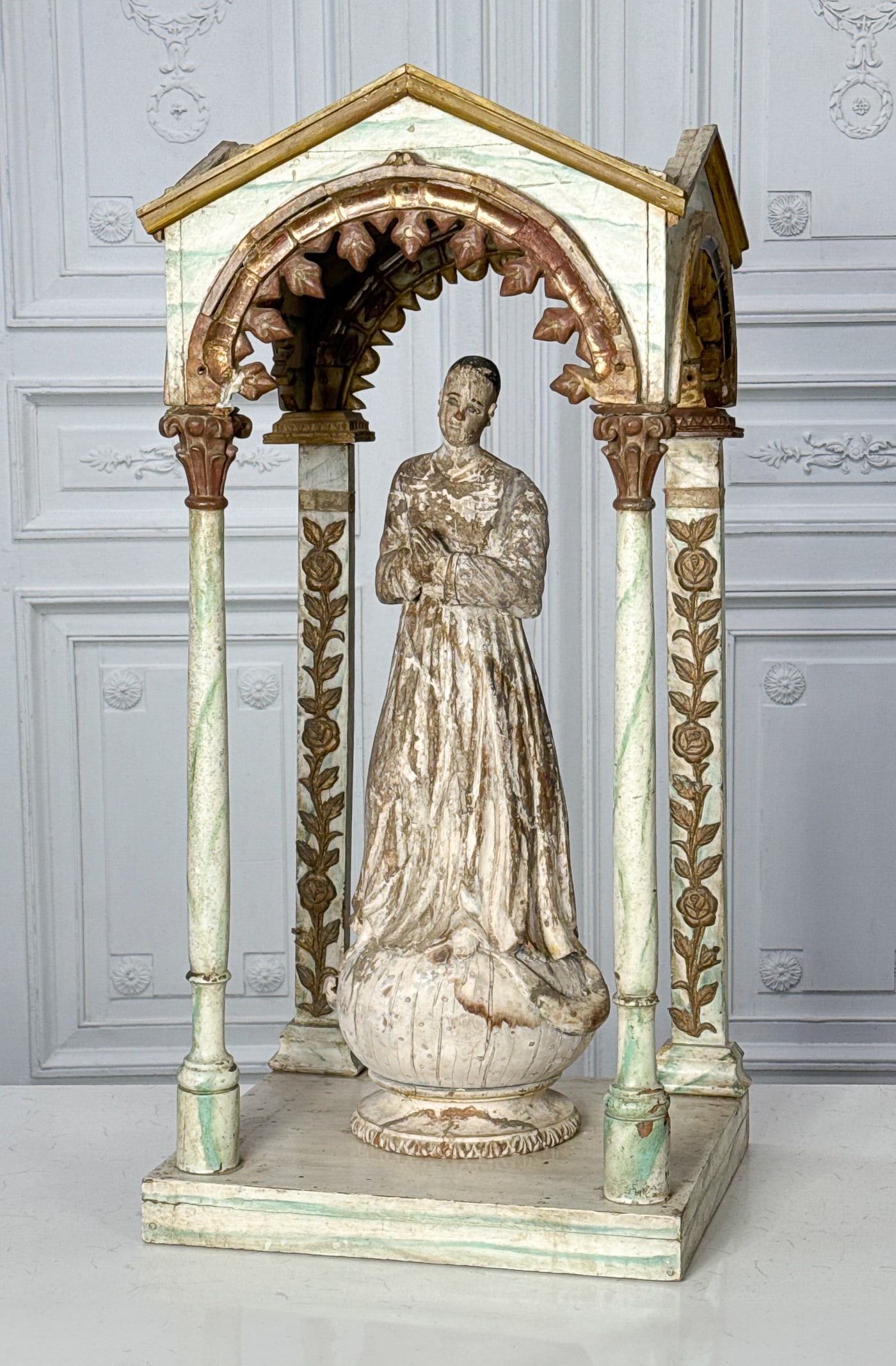 St. Thomas Santo Figure & Arched Case: St. Thomas Santo Figure & Arched Case, Probably Italian, 19th Century, Covered Acroteria Arched Openings And Columns Painted In Faux Marble, The Figure Standing In Robes With Hands In Prayer On A Glob