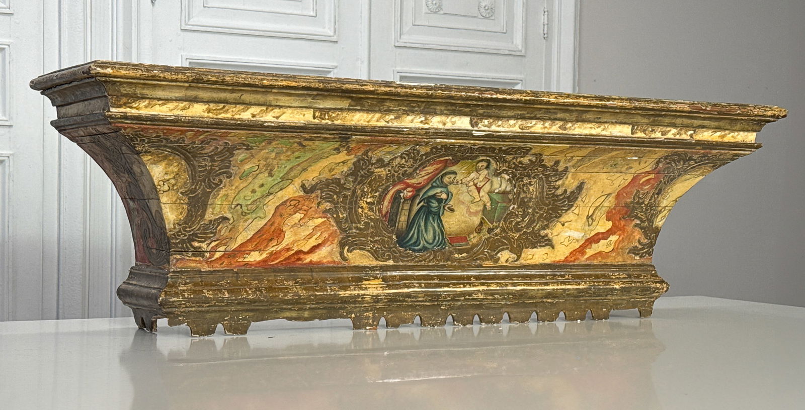 Large Baroque Painted Bracket Cornice: Large Baroque Painted Bracket Cornice, Italian, 18th Or 19th Century, St. Anthony Of Padua And Angel Scene In A Gilt Gesso Reserve And Faux Marbled Ground, Gilt Molded Crown And Base, Height 16, Width