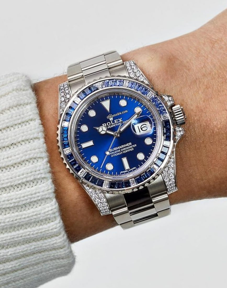 Rolex Sapphire & Diamond SS Submariner Timepiece: Rolex Sapphire & Diamond Stainless Steel Submariner Watch, Original Rolex Watch With Sapphire Blue Dial And After-Market Diamond Lugs, Sapphire And Baguette Diamond Bezel. Approximately 1ct Diamonds A