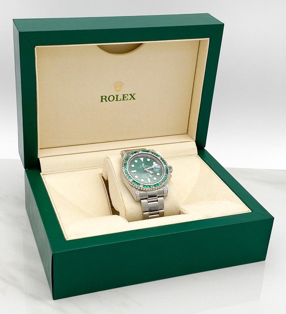 Rolex Emerald & Diamond SS Submariner Timepiece: Rolex Emerald & Diamond Stainless Steel Submariner Watch, Original Rolex Watch With Emerald Green Dial And After-Market Diamond Lugs And Emerald And Baguette Diamond Bezel. Approximately 1ct Diamonds