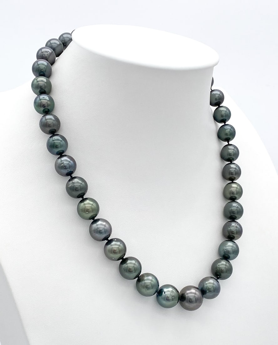 GIA Tahitian Pearl & 14k White Gold Necklace: GIA Certified Tahitian Pearls, 14k White Gold Clasp, 18 Inches, 83.7 Grams. See Photos For GIA Certificate Information. Note: Wire Transfer Or Cashiers Check Required For Payment Of This Lot.