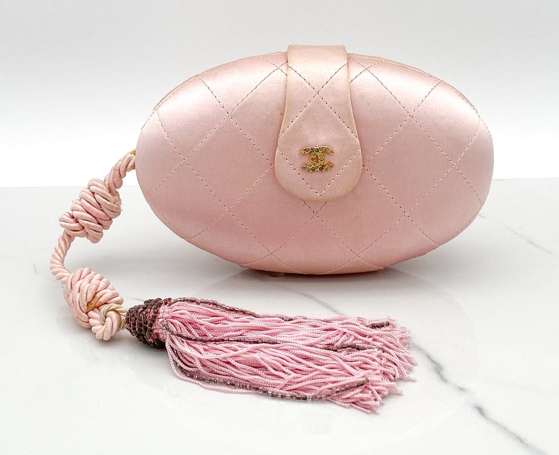 Scarce Chanel Egg Bag: Scarce Chanel Egg Bag, With Beaded Tassel Intact, Gold Plated Hardware. Approximately 3 1/2 Inches High By 5 1/2 Inches Wide, See Photos For Soiling To Back Side And UV Exposure. Fabric Has Pulled Awa
