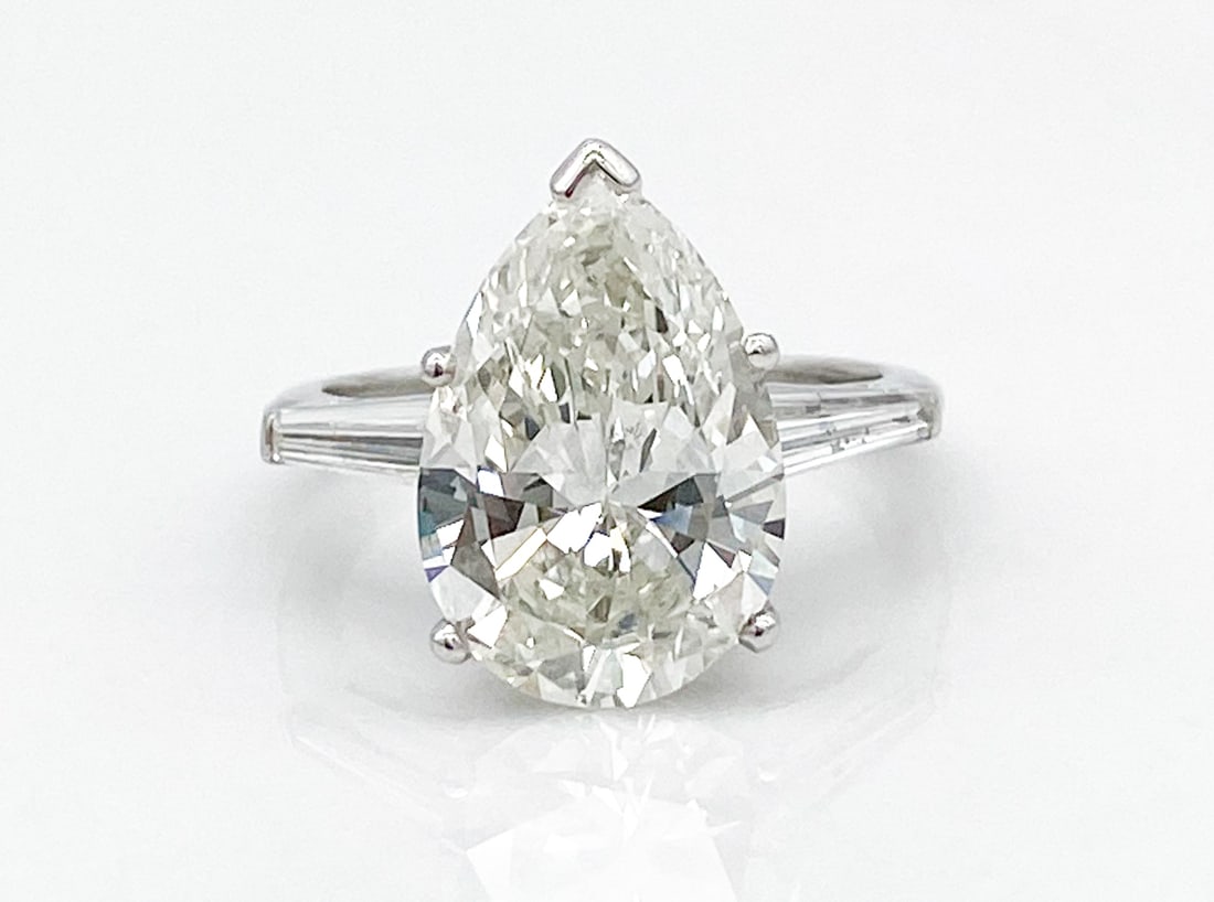 5.04 Carat Natural Diamond & Platinum Ring: 5.04 Carat Natural Pear Shaped Diamond, Double Certified H, Si1, In Platinum Setting With Baguettes At Sides, Size 6.75, Weight 6.1 Grams. See Included Appraisal And Certification Photos For
