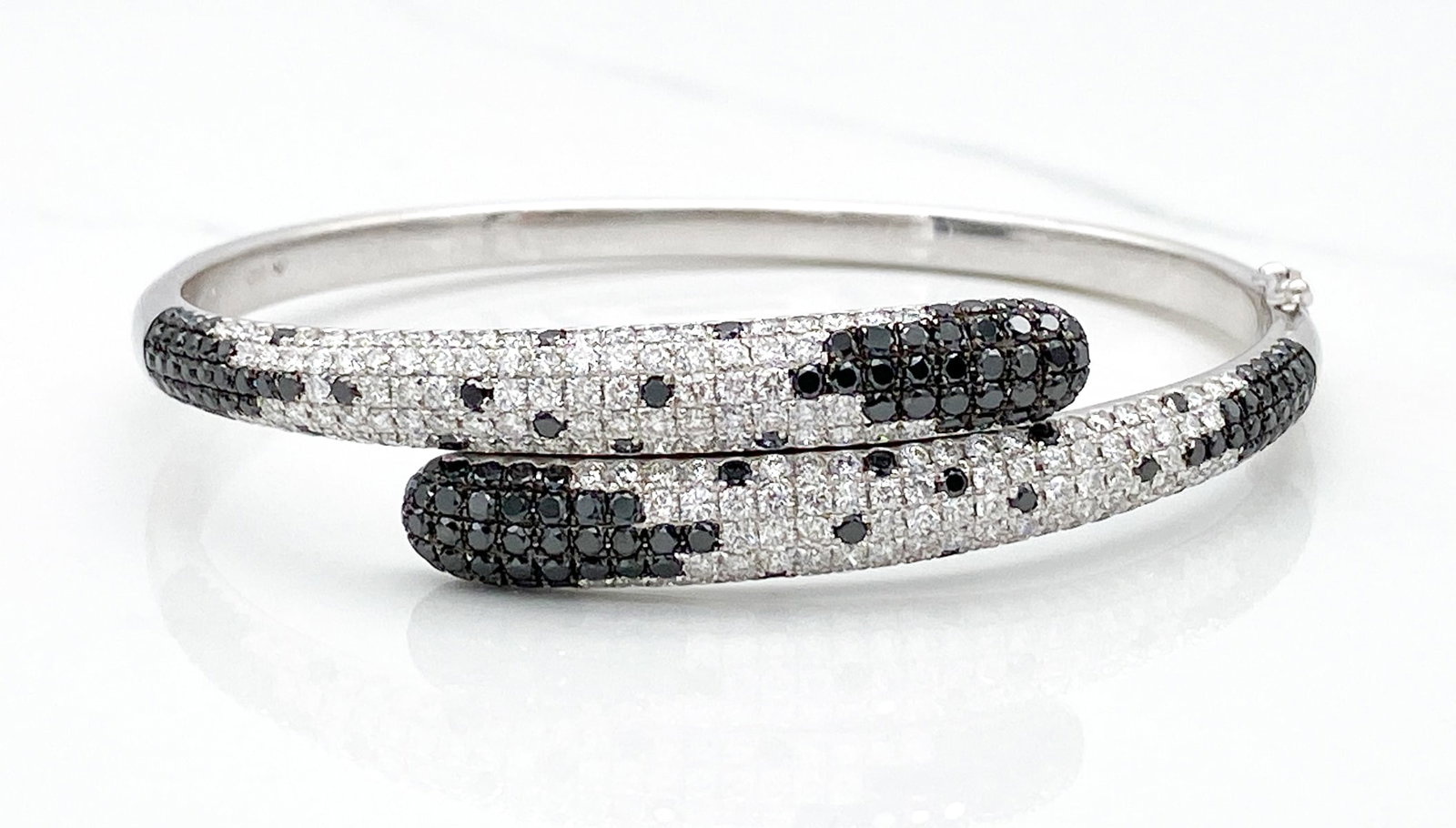 Black And White Natural Diamond Bypass Bracelet: Black And White Natural Diamond Bypass Bracelet, Approximately 4cts VS G-H-I Natural White And Black Diamonds Set In 18k White Gold, Fits Up To 7 Inches, Weight 21.6 Grams. Wire Transfer Or Zelle