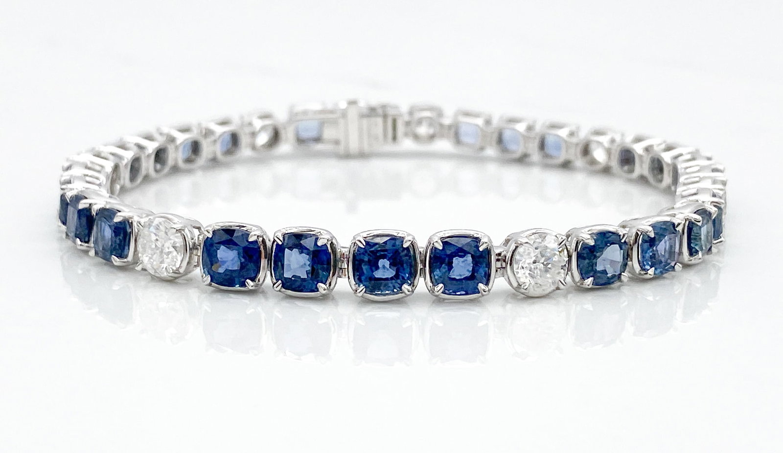 Sapphire & Natural Diamond 14k Bracelet: Sapphire & Natural Diamond 14k Bracelet, 12.89ctw Cushion Brilliant Cut Sapphires And 7 Natural Diamonds Weighing 2.61ctw, G-H Color, Si1-Si2 Clarity, 14k White Gold, Length 7 Inches, Total Weight 16.