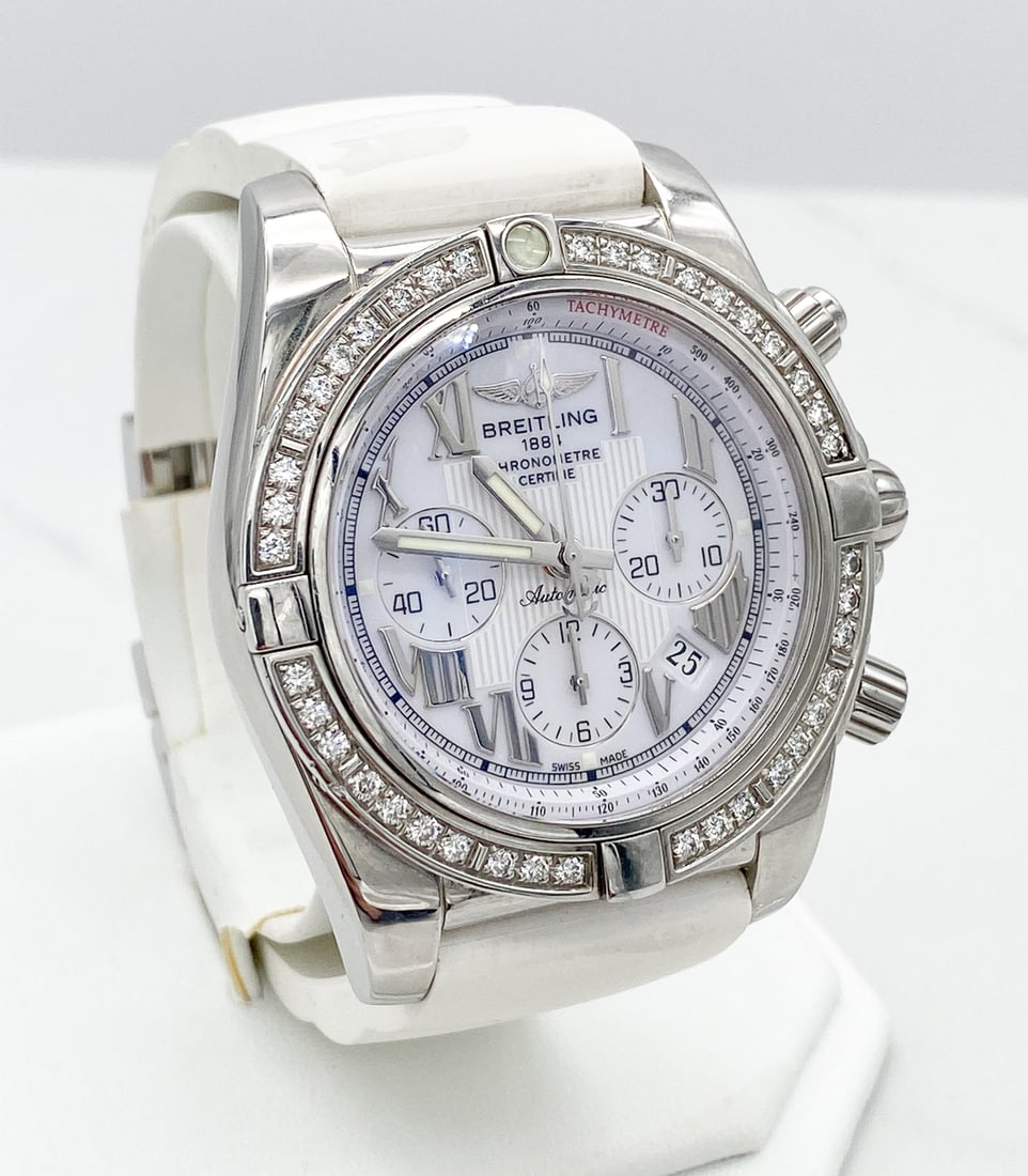 Breitling 40mm Stainless Chronograph Watch: Breitling 40mm Stainless Chronograph Watch With Factory Diamond Bezel, White Rubber Strap With Deployant Buckle, 7 3/4 Inches, Can Be Adjusted For Ladies Wrist, Includes Breitling Box. See Area Of