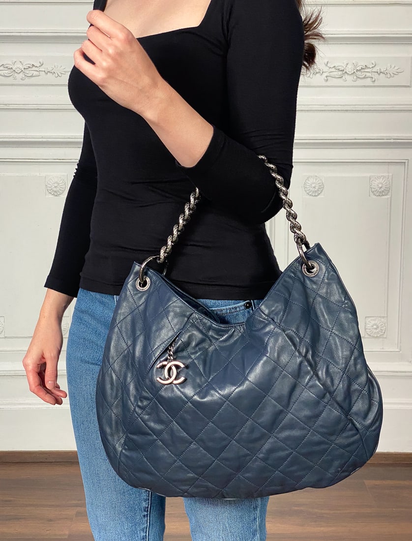 Chanel Navy Coco Pleats Hobo Bag: Chanel Navy Coco Pleats Hobo Bag, Navy Leather And Ruthenium Hardware, Date Code Sticker Indicates 2012 Production, Approximate Height 11 In, Width 16.25 In, Depth 2 In, Strap Drop 26.5 In, Handle Dro
