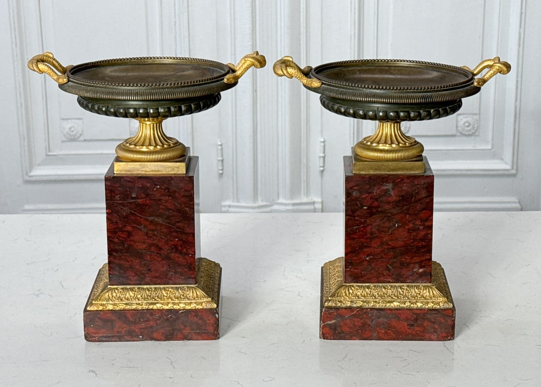 Empire Style Parcel Gilt Bronze Marble Garniture: Empire Style Parcel Gilt Bronze Marble Garniture, French, 19th Century, Pair Campagna Urns With Snake Handles On Rouge Marble Pedestals, Height 11, Width, 10, Depth 9 Inches, Chips To Marble Edges,