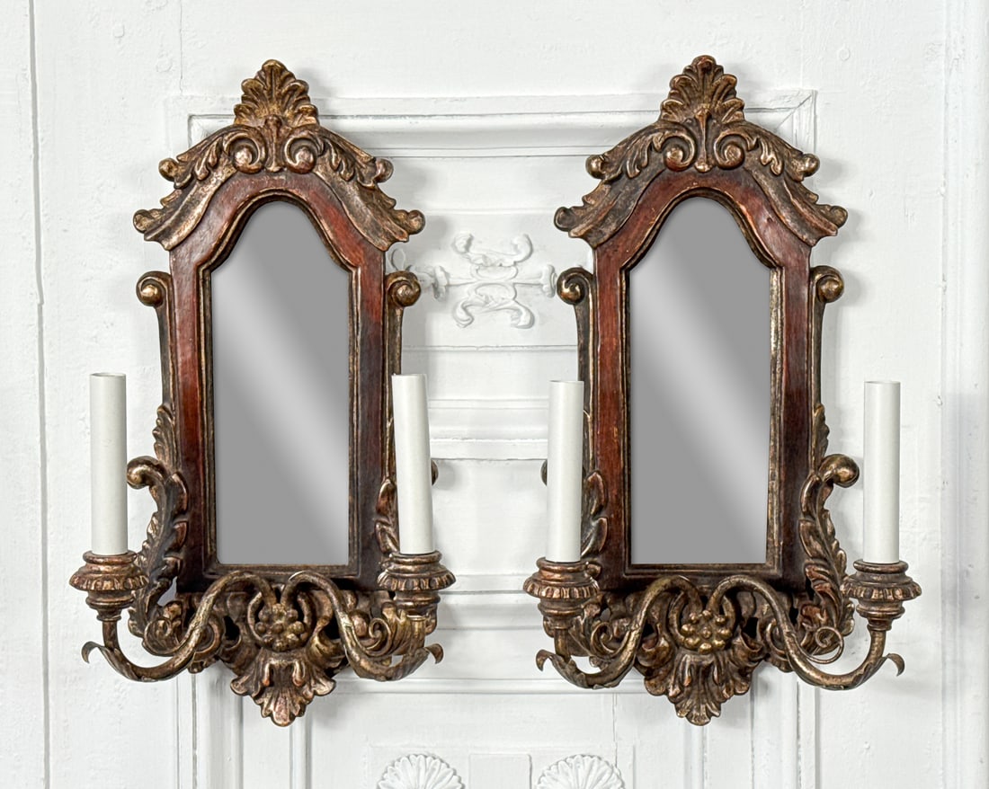 Pair Italian Parcel Giltwood Sconces: Pair Italian Parcel Giltwood Sconces, Each In The Baroque Taste With Foliate Crest, Arch Mirror, Two Lights On Scroll Arms, Height 19, Width 10.5, Depth 5.5 Inches, Structurally Sound And Presenting